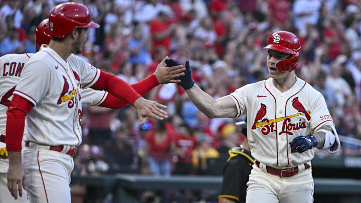 St. Louis Cardinals left fielder Tyler O'Neill (27) is congratulated by catcher Willson Contreras (40) and designated hitter Nolan Arenado (28) after hitting a three-run home run against the Pittsburgh Pirates during the second inning at Busch Stadium.
