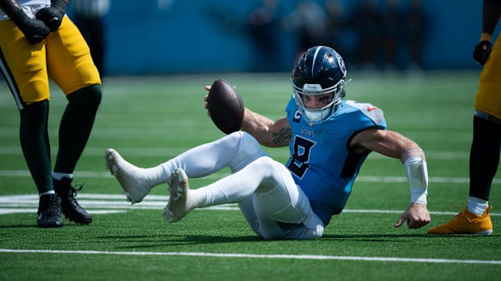 Tennessee Titans quarterback Will Levis (8) picks himself up short of the first down on a fourth-down play after being tackled by Green Bay Packers linebacker Quay Walker (7) in the third quarter during their game at Nissan Stadium in Nashville, Tenn., Sunday, Sept. 22, 2024. Tennessee Titans quarterback Will Levis (8) picks himself up short of the first down on a fourth-down play after being tackled by Green Bay Packers linebacker Quay Walker (7) in the third quarter during their game at Nissan Stadium in Nashville, Tenn., Sunday, Sept. 22, 2024.