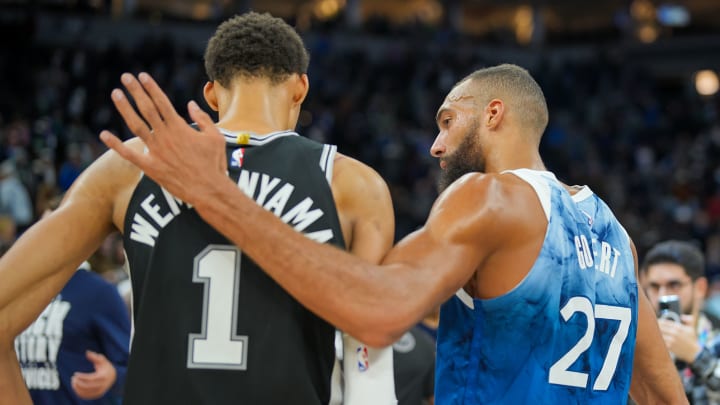 Feb 27, 2024; Minneapolis, Minnesota, USA; Minnesota Timberwolves center Rudy Gobert (27) and San Antonio Spurs center Victor Wembanyama (1) talk after the game at Target Center. 