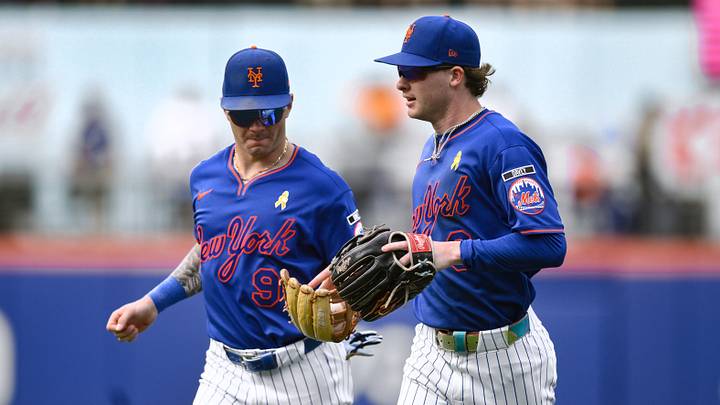 New York Mets outfielders Carson Benge and A.J. Ewing jog off the field after a great defensive play by Carson Benge. New York Mets outfielders Carson Benge and A.J. Ewing jog off the field after a great defensive play by Carson Benge.