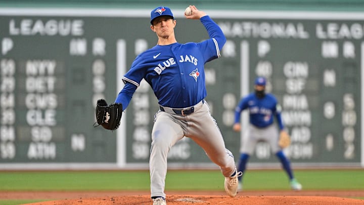 Toronto Blue Jays pitcher Easton Lucas throws a pitch off the mound, wearing a blue jersey and a matching hat. 