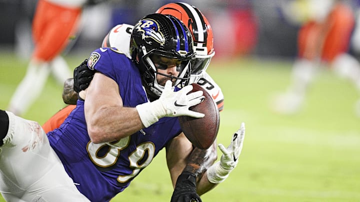 Jan 4, 2025; Baltimore, Maryland, USA; Baltimore Ravens tight end Mark Andrews (89) makes a catch for a touchdown during the second quarter as Cleveland Browns safety Grant Delpit (9) defends at M&T Bank Stadium. Mandatory Credit: Tommy Gilligan-Imagn Images