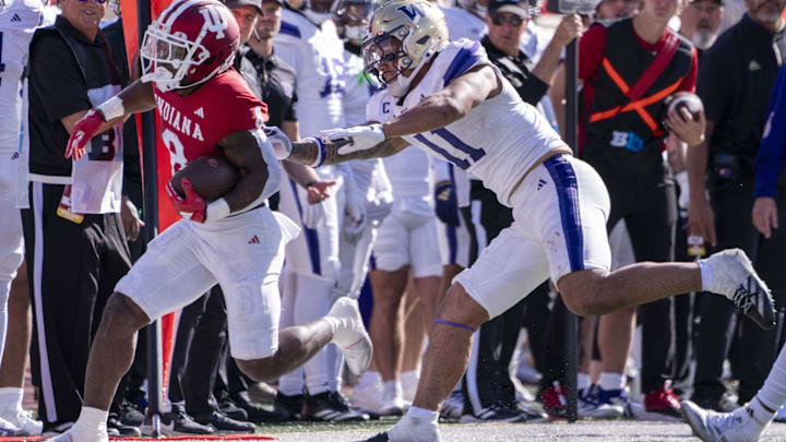 Oct 26, 2024; Bloomington, Indiana, USA; Indiana Hoosiers running back Kaelon Black (8) runs out of bounds during the fourth quarter against the Washington Huskies at Memorial Stadium. Mandatory Credit: Jacob Musselman-Imagn Images
