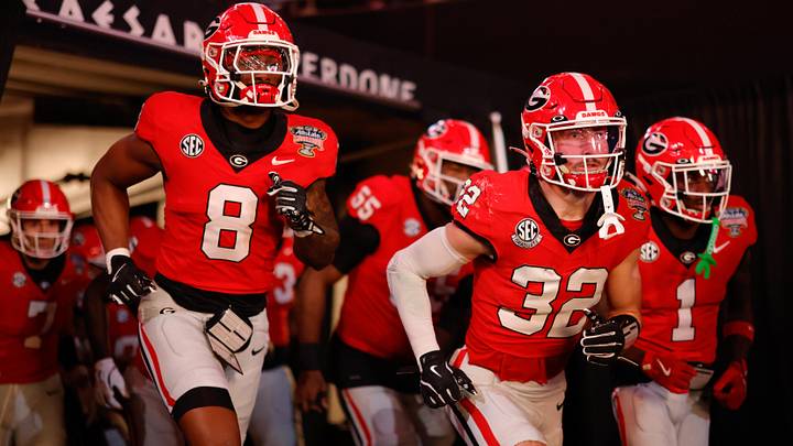 Jan 1, 2026; New Orleans, LA, USA; The Georgia Bulldogs run onto the field prior to the 2026 Sugar Bowl and quarterfinal game of the College Football Playoff against the Mississippi Rebels at Caesars Superdome. Mandatory Credit: Amber Searls-Imagn Images Jan 1, 2026; New Orleans, LA, USA; The Georgia Bulldogs run onto the field prior to the 2026 Sugar Bowl and quarterfinal game of the College Football Playoff against the Mississippi Rebels at Caesars Superdome. Mandatory Credit: Amber Searls-Imagn Images