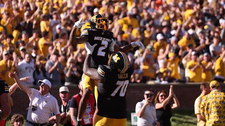 Oct 3, 2026; Columbia, Missouri, USA; Missouri Tigers wide receiver Caleb Goodie (2) celebrates a touchdown with offensive line Cayden Green (70) in the second quarter against the Florida Gators at Faurot Field at Memorial Stadium. Mandatory Credit: William Purnell-Imagn Images Oct 3, 2026; Columbia, Missouri, USA; Missouri Tigers wide receiver Caleb Goodie (2) celebrates a touchdown with offensive line Cayden Green (70) in the second quarter against the Florida Gators at Faurot Field at Memorial Stadium. Mandatory Credit: William Purnell-Imagn Images