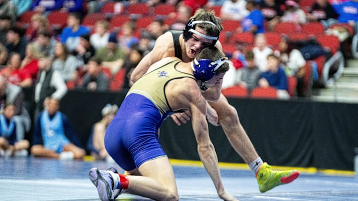 Muscatine’s Braxton Wade wrestles against Southeast Polk’s Nico DeSalvo at 138 lbs. on Feb. 18, 2026, at Casey’s Center in Des Moines. Muscatine’s Braxton Wade wrestles against Southeast Polk’s Nico DeSalvo at 138 lbs. on Feb. 18, 2026, at Casey’s Center in Des Moines.