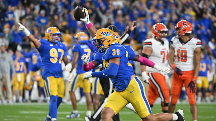Oct 24, 2024; Pittsburgh, Pennsylvania, USA; Pittsburgh Panthers linebacker Brandon George (30) celebrates and interception against the Syracuse Orange during the first quarter at Acrisure Stadium. Mandatory Credit: Barry Reeger-Imagn Images Oct 24, 2024; Pittsburgh, Pennsylvania, USA; Pittsburgh Panthers linebacker Brandon George (30) celebrates and interception against the Syracuse Orange during the first quarter at Acrisure Stadium. Mandatory Credit: Barry Reeger-Imagn Images