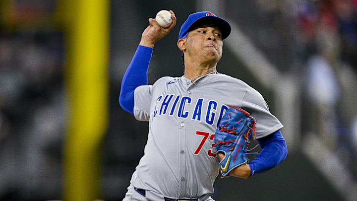 Mar 31, 2024; Arlington, Texas, USA; Chicago Cubs relief pitcher Adbert Alzolay (73) pitches during the game between the Texas Rangers and the Chicago Cubs at Globe Life Field. 
