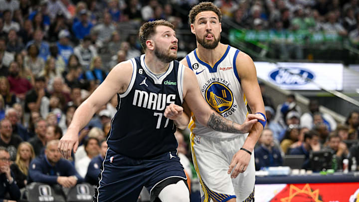 Mar 22, 2023; Dallas, Texas, USA; Dallas Mavericks guard Luka Doncic (77) and Golden State Warriors guard Klay Thompson (11) in action during the game between the Dallas Mavericks and the Golden State Warriors at the American Airlines Center. Mandatory Credit: Jerome Miron-USA TODAY Sports