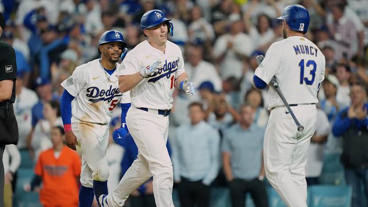 Mar 26, 2026; Los Angeles, California, USA; Los Angeles Dodgers catcher Will Smith (16) celebrates with infielder Mookie Betts (50) and infielder Max Muncy (13) after hitting a two run home run against the Arizona Diamondbacks during the seventh inning at Dodger Stadium. Mandatory Credit: Kirby Lee-Imagn Images Mar 26, 2026; Los Angeles, California, USA; Los Angeles Dodgers catcher Will Smith (16) celebrates with infielder Mookie Betts (50) and infielder Max Muncy (13) after hitting a two run home run against the Arizona Diamondbacks during the seventh inning at Dodger Stadium. Mandatory Credit: Kirby Lee-Imagn Images