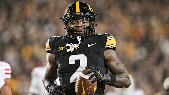 Nov 2, 2024; Iowa City, Iowa, USA;  Iowa Hawkeyes running back Kaleb Johnson (2) runs for a 16 yard touchdown against the Wisconsin Badgers during the second quarter at Kinnick Stadium.
