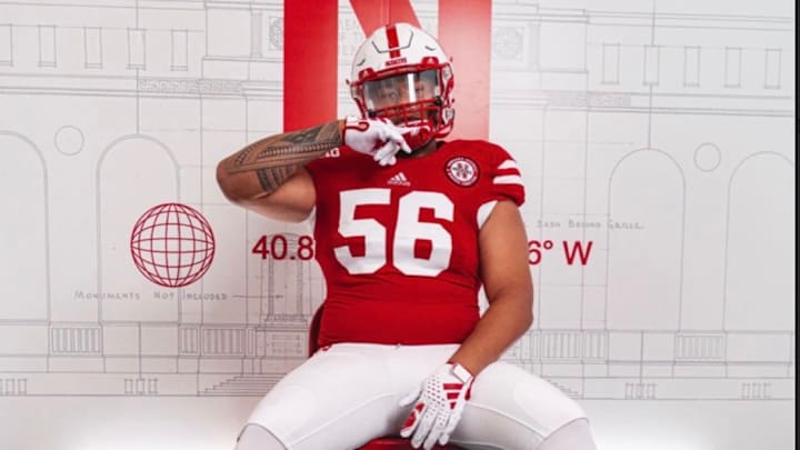 Houston Kaahaaina-Torres wearing a Nebraska uniform in his commitment announcement.