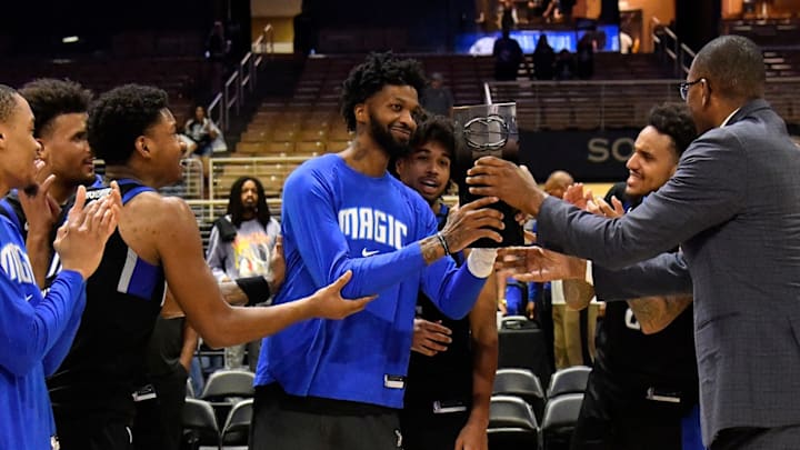 The Osceola Magic receive the championship trophy from G-League Commissioner Shareef Abdul-Rahim after defeating the Maine Celtics to win the NBA G-League Eastern Conference Championship on April 6, 2025 at Silver Spurs Arena in Kissimmee, Florida.