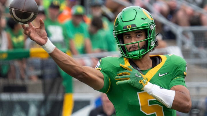 Oregon quarterback Dante Moore throws downfield against Oklahoma State during the second quarter at Autzen.