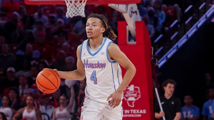 Houston Cougars guard Kingston Flemings dribbles against the West Virginia Mountaineers in the second half at Fertitta Center.