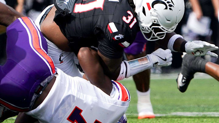 Northwestern State Demons defensive end Jeremiah Bodwin (7) tackles Cincinnati Bearcats linebacker Simeon Coleman (31) in the first quarter of a NCAA men’s college football game between the Cincinnati Bearcats and Northwestern State Demons, Saturday, Sept. 13, 2025, at Nippert Stadium in Cincinnati. Bearcats are up 56-0 by halftime. Northwestern State Demons defensive end Jeremiah Bodwin (7) tackles Cincinnati Bearcats linebacker Simeon Coleman (31) in the first quarter of a NCAA men’s college football game between the Cincinnati Bearcats and Northwestern State Demons, Saturday, Sept. 13, 2025, at Nippert Stadium in Cincinnati. Bearcats are up 56-0 by halftime.