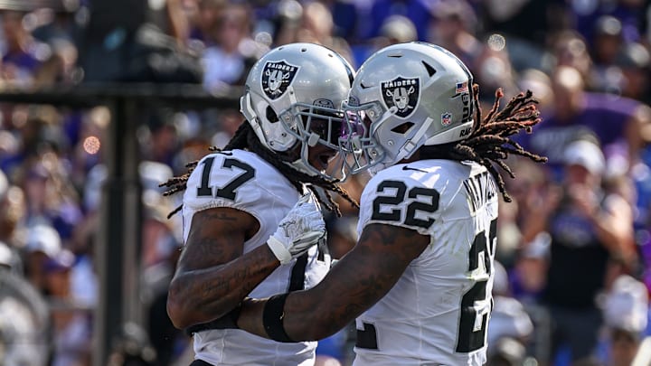 Sep 15, 2024; Baltimore, Maryland, USA; Las Vegas Raiders running back Alexander Mattison (22) scores a touchdown and celebrates with wide receiver Davante Adams (17) during the second half against the Baltimore Ravens at M&T Bank Stadium. Mandatory Credit: Reggie Hildred-Imagn Images