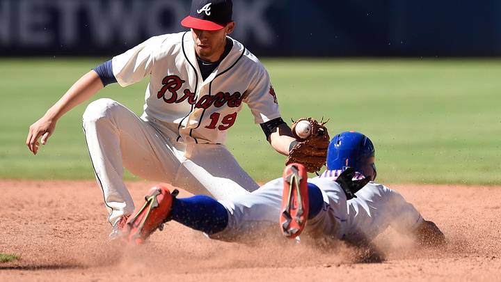 Sep 13, 2015; Atlanta, GA, USA; Atlanta Braves shortstop Andrelton Simmons (19) tags out New York Mets Eric Young Jr. (1) trying to steal during the eighth inning at Turner Field. Mandatory Credit: Dale Zanine-Imagn Images Sep 13, 2015; Atlanta, GA, USA; Atlanta Braves shortstop Andrelton Simmons (19) tags out New York Mets Eric Young Jr. (1) trying to steal during the eighth inning at Turner Field. Mandatory Credit: Dale Zanine-Imagn Images