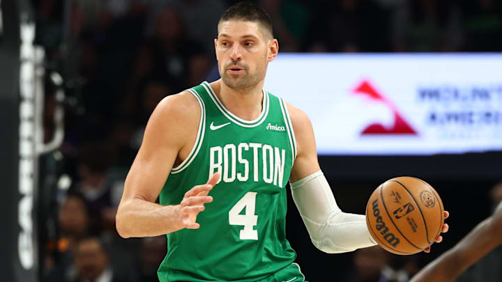 Feb 24, 2026; Phoenix, Arizona, USA; Boston Celtics center Nikola Vucevic (4) against the Phoenix Suns at Mortgage Matchup Center. Mandatory Credit: Mark J. Rebilas-Imagn Images