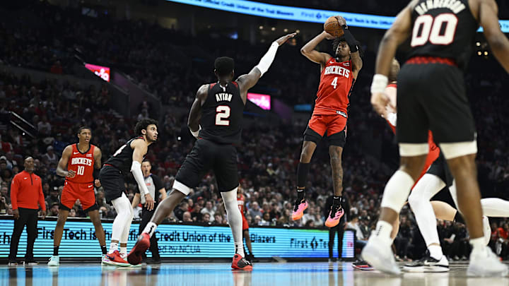 Apr 12, 2024; Portland, Oregon, USA; Houston Rockets guard Jalen Green (4) shoots a jump shot during the first half against Portland Trail Blazers center Deandre Ayton (2) at Moda Center. Mandatory Credit: Troy Wayrynen-Imagn Images
