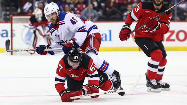 Sep 30, 2024; Newark, New Jersey, USA; New York Rangers defenseman Casey Fitzgerald (45) hits New Jersey Devils left wing Xavier Parent (67) during the second period at Prudential Center. Mandatory Credit: Ed Mulholland-Imagn Images Sep 30, 2024; Newark, New Jersey, USA; New York Rangers defenseman Casey Fitzgerald (45) hits New Jersey Devils left wing Xavier Parent (67) during the second period at Prudential Center. Mandatory Credit: Ed Mulholland-Imagn Images