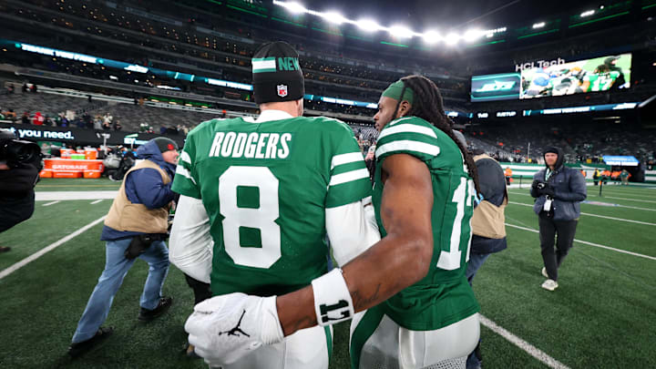Jan 5, 2025; East Rutherford, New Jersey, USA; New York Jets quarterback Aaron Rodgers (8) and wide receiver Davante Adams (17) walk on the field after the Jets win over the Miami Dolphins at MetLife Stadium. Mandatory Credit: Ed Mulholland-Imagn Images Jan 5, 2025; East Rutherford, New Jersey, USA; New York Jets quarterback Aaron Rodgers (8) and wide receiver Davante Adams (17) walk on the field after the Jets win over the Miami Dolphins at MetLife Stadium. Mandatory Credit: Ed Mulholland-Imagn Images