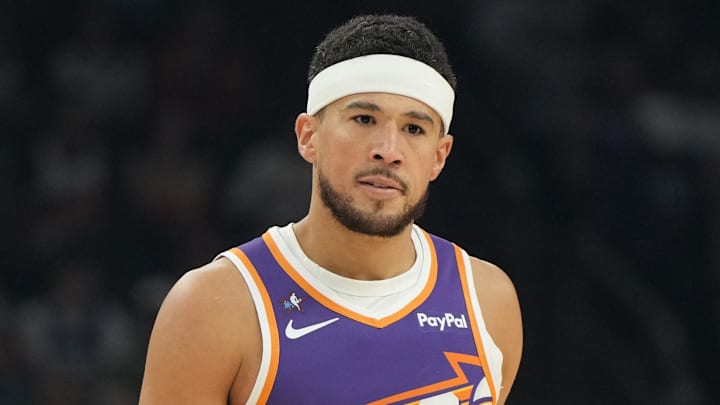 Feb 7, 2026; Phoenix, Arizona, USA; Phoenix Suns guard Devin Booker (1) reacts against the Philadelphia 76ers during the first half of an NBA game at Mortgage Matchup Center. Mandatory Credit: Rick Scuteri-Imagn Images Feb 7, 2026; Phoenix, Arizona, USA; Phoenix Suns guard Devin Booker (1) reacts against the Philadelphia 76ers during the first half of an NBA game at Mortgage Matchup Center. Mandatory Credit: Rick Scuteri-Imagn Images