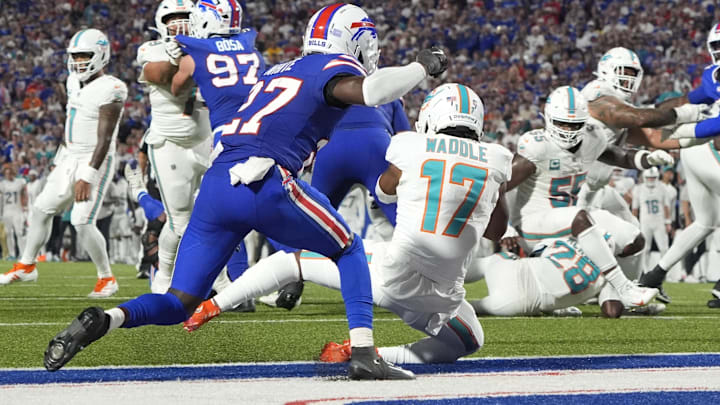 Miami Dolphins wide receiver Jaylen Waddle (17) scores a touchdown against Buffalo Bills cornerback Tre'Davious White (27) in the second quarter at Highmark Stadium. Miami Dolphins wide receiver Jaylen Waddle (17) scores a touchdown against Buffalo Bills cornerback Tre'Davious White (27) in the second quarter at Highmark Stadium.