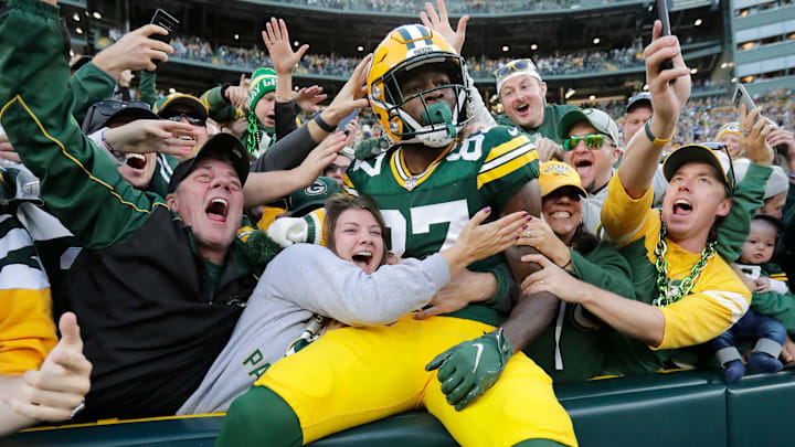 Green Bay Packers wide receiver Romeo Doubs celebrates with fans after scoring a touchdown against the New England Patriots on Oct. 2 at Lambeau Field. Green Bay Packers wide receiver Romeo Doubs celebrates with fans after scoring a touchdown against the New England Patriots on Oct. 2 at Lambeau Field.