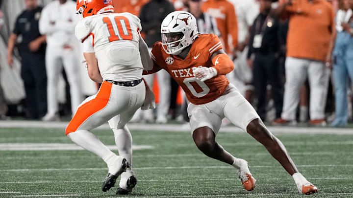 Sep 20, 2025; Austin, Texas, USA; Texas Longhorns linebacker Anthony Hill Jr (0) tackles Sam Houston Bearkats quarterback Grant Gunnell (10) during the second half at Darrell K Royal-Texas Memorial Stadium. Mandatory Credit: Scott Wachter-Imagn Images Sep 20, 2025; Austin, Texas, USA; Texas Longhorns linebacker Anthony Hill Jr (0) tackles Sam Houston Bearkats quarterback Grant Gunnell (10) during the second half at Darrell K Royal-Texas Memorial Stadium. Mandatory Credit: Scott Wachter-Imagn Images