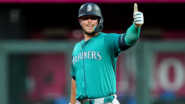 Seattle Mariners first baseman Ty France gestures after hitting an RBI double against the Kansas City Royals on June 7, 2024, at Kauffman Stadium.