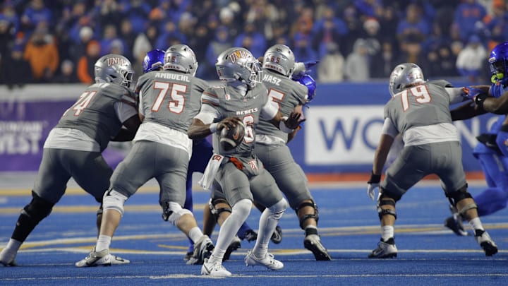 Dec 6, 2024; Boise, ID, USA; UNLV Rebels quarterback Hajj-Malik Williams (6) throws down field during the second half against the Boise State Broncos at Albertsons Stadium. Boise State beats  UNLV 21-7. Mandatory Credit: Brian Losness-Imagn Images

