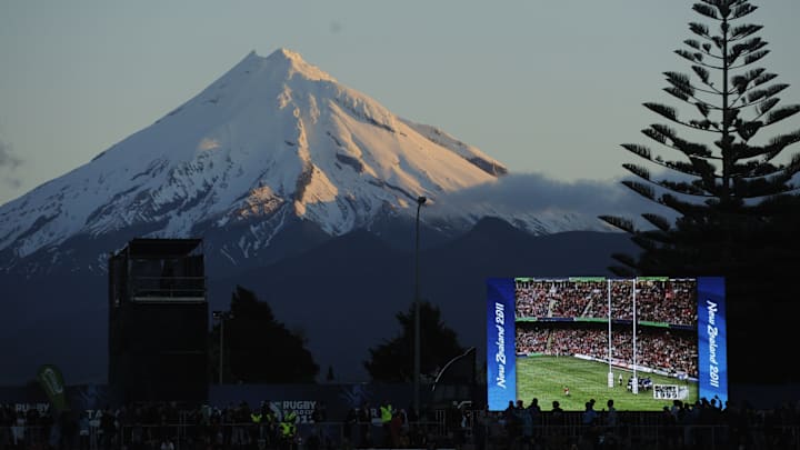 Rugby match is seen on a big screen with