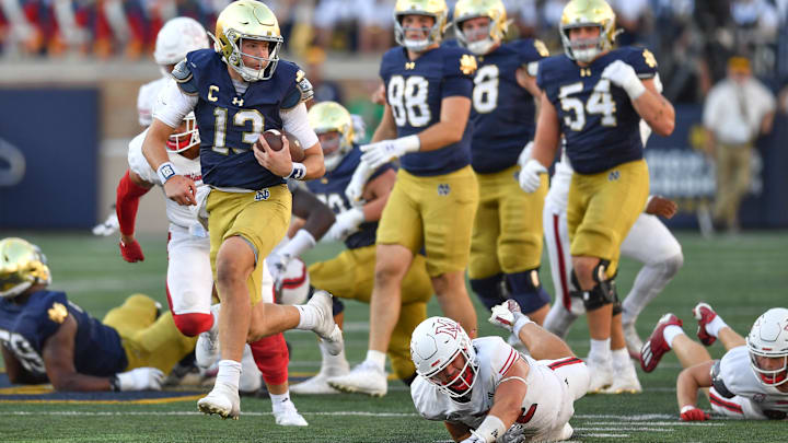 Sep 21, 2024; South Bend, Indiana, USA; Notre Dame Fighting Irish quarterback Riley Leonard (13) runs for a touchdown in the fourth quarter against the Miami Redhawks at Notre Dame Stadium. Sep 21, 2024; South Bend, Indiana, USA; Notre Dame Fighting Irish quarterback Riley Leonard (13) runs for a touchdown in the fourth quarter against the Miami Redhawks at Notre Dame Stadium.