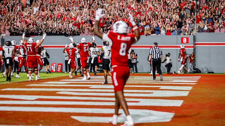 Sep 26, 2026; Raleigh, North Carolina, USA; NC State Wolfpack fans celebrate quarterback CJ Bailey (11) touchdown during the first half of the game against App State Mountaineers at Carter-Finley Stadium. Mandatory Credit: Jaylynn Nash-Imagn Images Sep 26, 2026; Raleigh, North Carolina, USA; NC State Wolfpack fans celebrate quarterback CJ Bailey (11) touchdown during the first half of the game against App State Mountaineers at Carter-Finley Stadium. Mandatory Credit: Jaylynn Nash-Imagn Images
