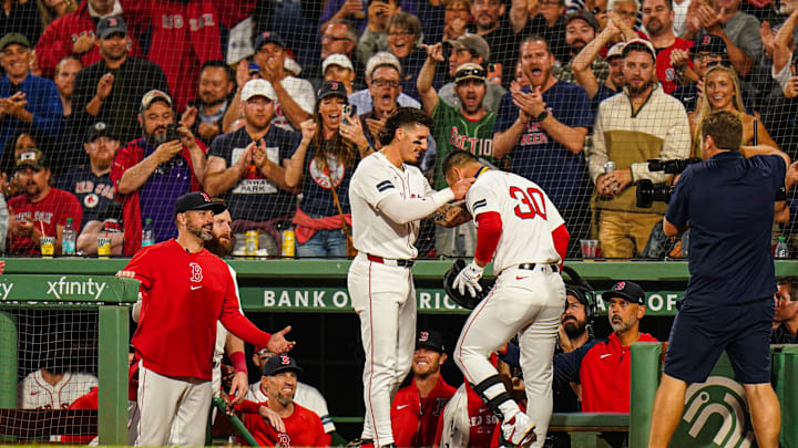Sep 9, 2024; Boston, Massachusetts, USA; Boston Red Sox right fielder Rob Refsnyder (30) is congratulated by eft fielder Jarren Duran (16) after hitting a two run home run against the Baltimore Orioles in the third inning at Fenway Park. Mandatory Credit: David Butler II-Imagn Images