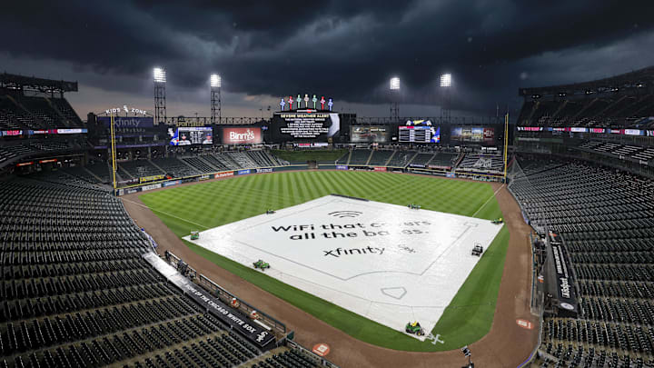 Jul 5, 2023; Chicago, Illinois, USA; A tarp covers the infield during a rain delay before a game