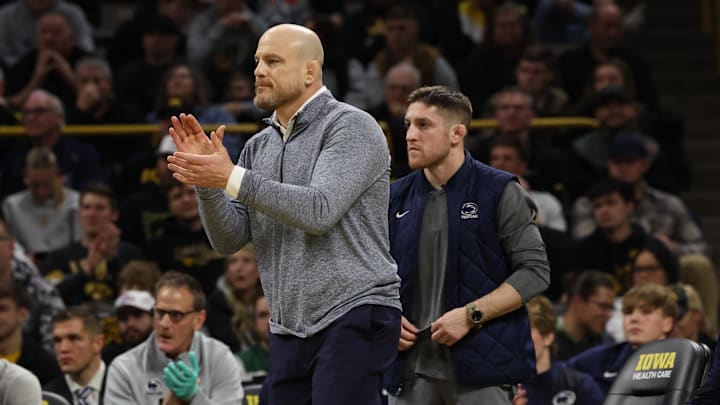 Penn State Nittany Lions wrestling oach Cael Sanderson watches his team wrestle the Iowa Hawkeyes at Carver-Hawkeye Arena. Penn State Nittany Lions wrestling oach Cael Sanderson watches his team wrestle the Iowa Hawkeyes at Carver-Hawkeye Arena.