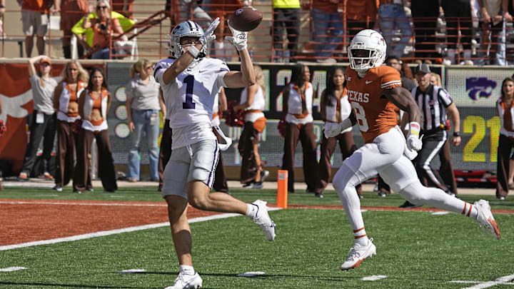 Nov 4, 2023; Austin, Texas, USA; Kansas State Wildcats wide receiver Jayce Brown (1) catches a touchdown pass while defended by Texas Longhorns defensive back Terrance Brooks (8) during the second half at Darrell K Royal-Texas Memorial Stadium. Mandatory Credit: Scott Wachter-USA TODAY Sports