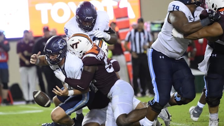 Sep 2, 2023; Virginia Tech defensive lineman Antwaun Powell-Ryland (52)  forces a fumble from Old Dominion quarterback Grant Wilson (13).