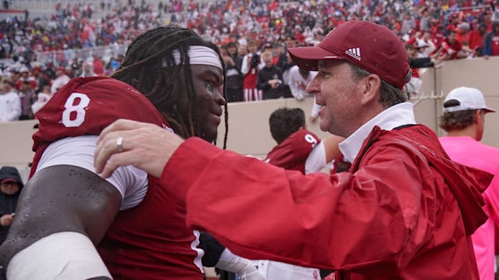 Sep 28, 2024; Bloomington, Indiana, USA;  Indiana Hoosiers defensive lineman CJ West (8) celebrates with vice president and director of intercollegiate athletics Scott Dolson after a game against the Maryland Terrapins at Memorial Stadium. Mandatory Credit: Robert Goddin-Imagn Images