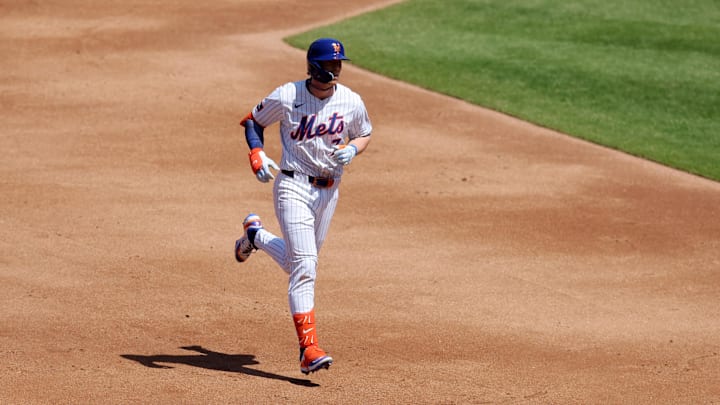 Apr 23, 2025; New York City, New York, USA; New York Mets second baseman Brett Baty (7) rounds the bases after hitting a two run home run against the Philadelphia Phillies during the second inning at Citi Field. Mandatory Credit: Brad Penner-Imagn Images