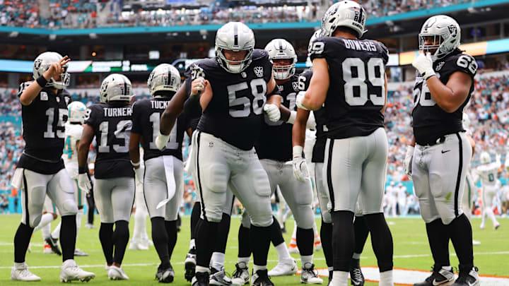 Nov 17, 2024; Miami Gardens, Florida, USA; Las Vegas Raiders tight end Brock Bowers (89) celebrates with guard Jackson Powers-Johnson (58) after scoring a touchdown against the Miami Dolphins during the third quarter at Hard Rock Stadium. Mandatory Credit: Sam Navarro-Imagn Images