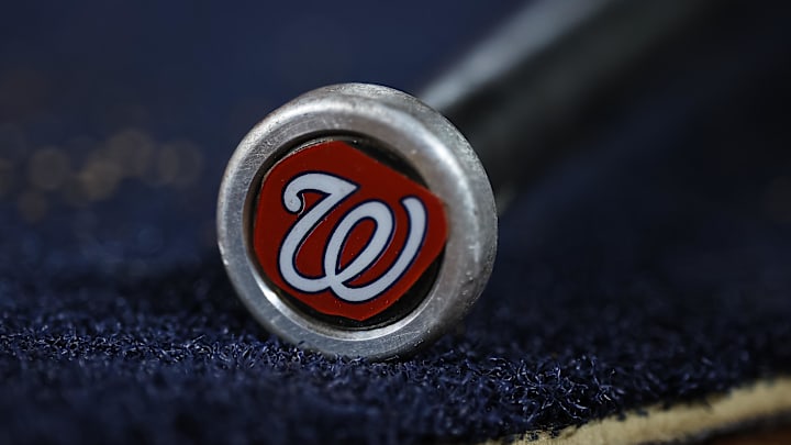 May 12, 2023; Washington, District of Columbia, USA; A detailed view of the Washington Nationals logo on a weighted bat during the seventh inning of the game between the Washington Nationals and the New York Mets at Nationals Park.