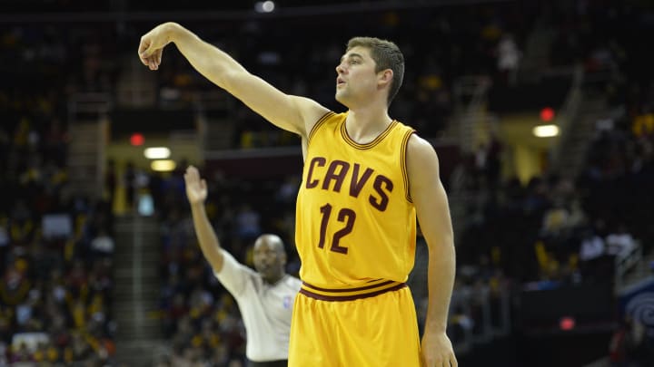 Oct 17, 2014; Cleveland, OH, USA; Cleveland Cavaliers guard Joe Harris (12) follows through on a three-point basket in the fourth quarter against the Dallas Mavericks at Quicken Loans Arena. Mandatory Credit: David Richard-USA TODAY Sports