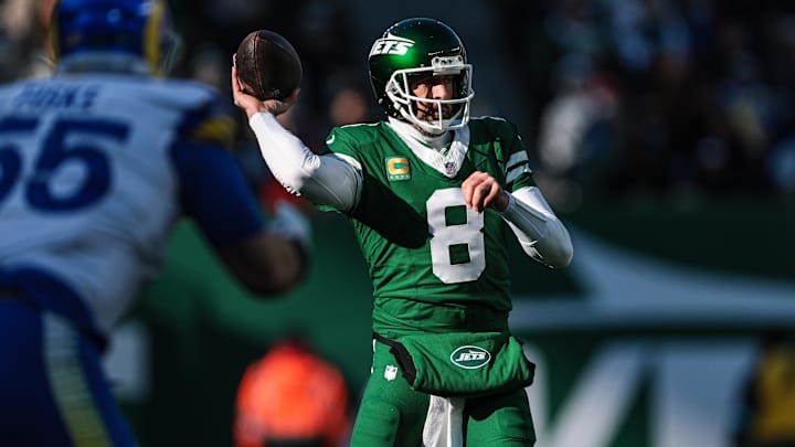 Dec 22, 2024; East Rutherford, New Jersey, USA; New York Jets quarterback Aaron Rodgers (8) throws the ball during the first half against the Los Angeles Rams at MetLife Stadium.