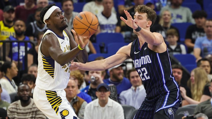 Indiana Pacers forward Pascal Siakam (43) passes the ball around Orlando Magic forward Franz Wagner (22) during the first quarter at Kia Center.