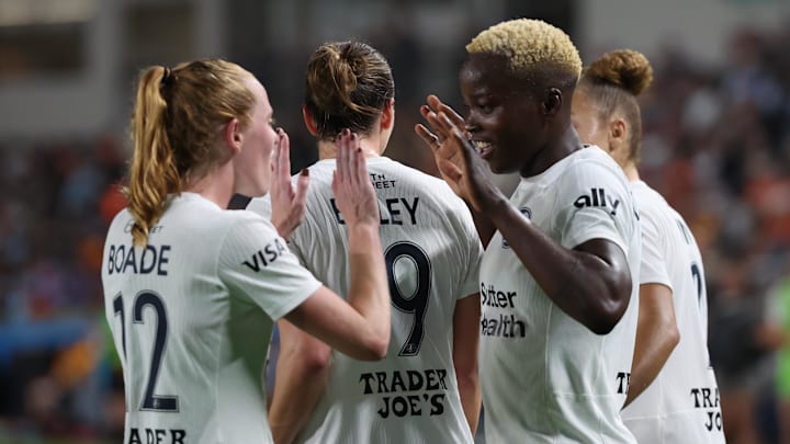 Bay FC forward Racheal Kundananji (9) celebrates a goal with Bay FC forward Tess Boade (12) in the second half against the Houston Dash at Shell Energy Stadium 
