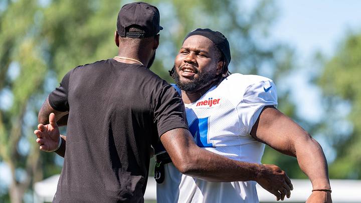 Aug 3, 2026; Allen Park, MI, USA; Detroit Lions defensive lineman Alim McNeill (54) hugs former Detroit Lions wide receiver Calvin Johnson following Detroit Lions training camp. Mandatory Credit: Paul Barnick-Imagn Images Aug 3, 2026; Allen Park, MI, USA; Detroit Lions defensive lineman Alim McNeill (54) hugs former Detroit Lions wide receiver Calvin Johnson following Detroit Lions training camp. Mandatory Credit: Paul Barnick-Imagn Images