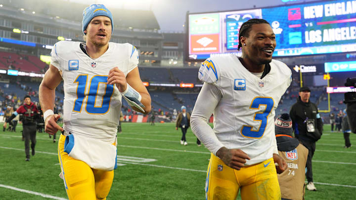 Dec 28, 2024; Foxborough, Massachusetts, USA; Los Angeles Chargers quarterback Justin Herbert (10) and safety Derwin James Jr. (3) run off the field after defeating the New England Patriots in the second half at Gillette Stadium. Mandatory Credit: David Butler II-Imagn Images